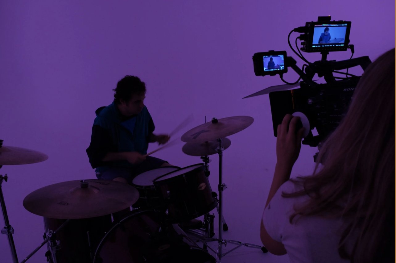 Folded Crane Films crew filming a drummer